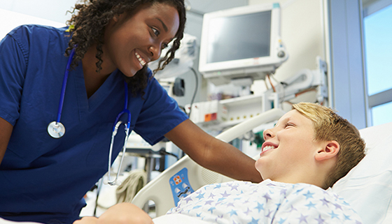 Boy Talking To Female Nurse In Emergency Room