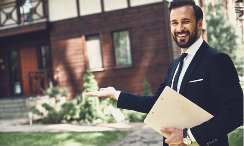 young realtor looking happy